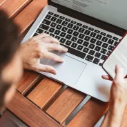 Man working on laptop and mobile at the same time