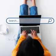 Woman typing into a search engine